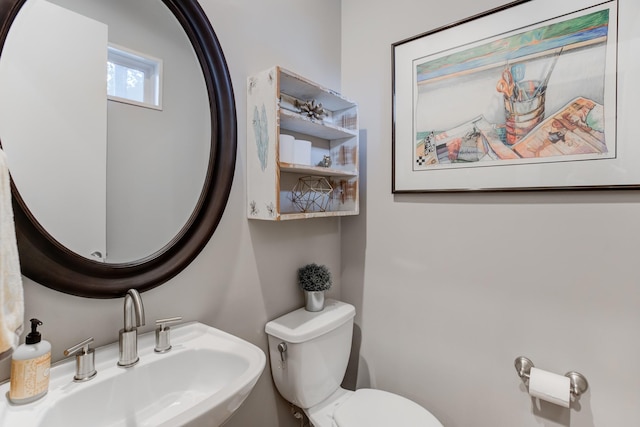 bathroom featuring toilet and sink