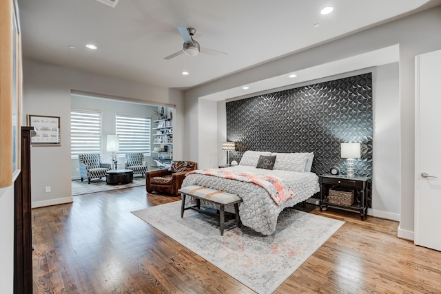 bedroom featuring ceiling fan and light hardwood / wood-style floors