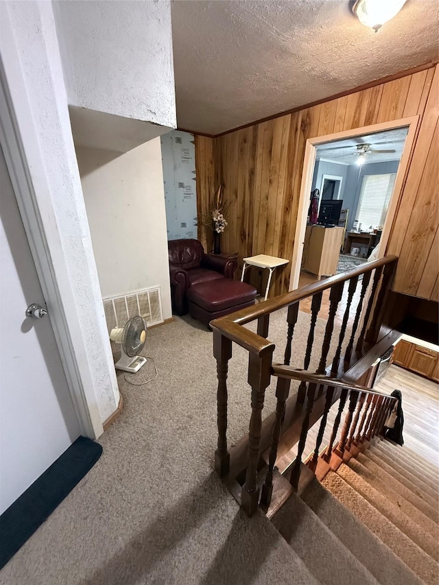 interior space with carpet and a textured ceiling