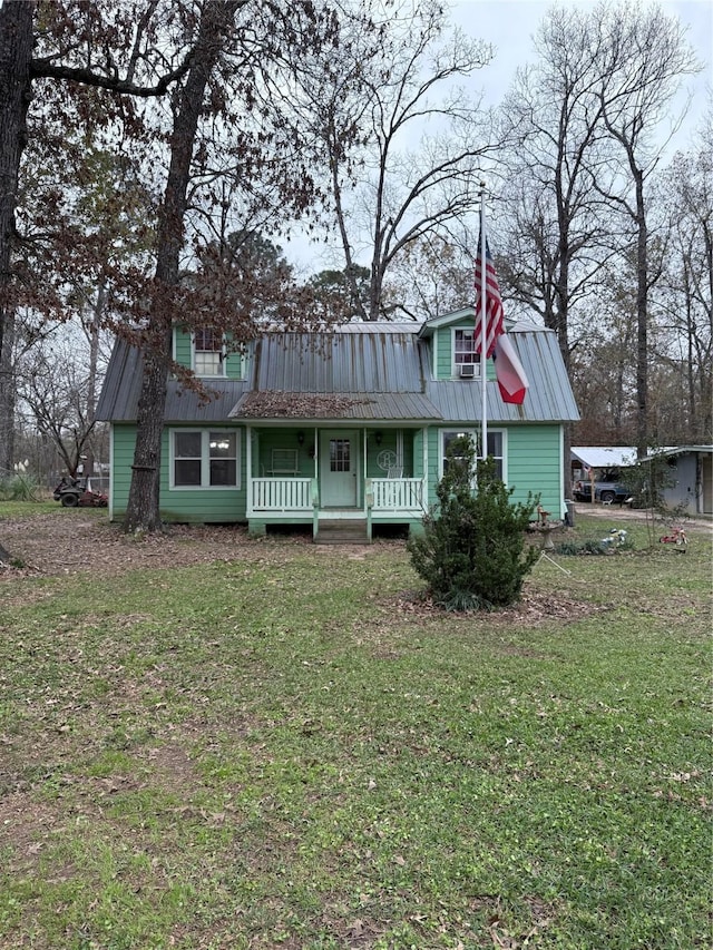 view of front facade with covered porch and a front lawn