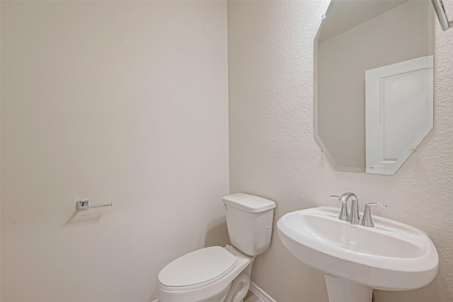 bathroom with sink and toilet