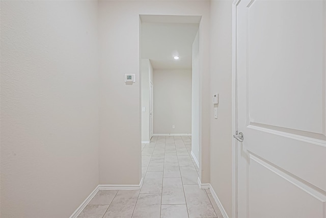 hallway featuring light tile patterned floors