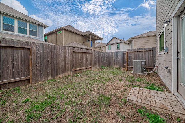 view of yard with central AC