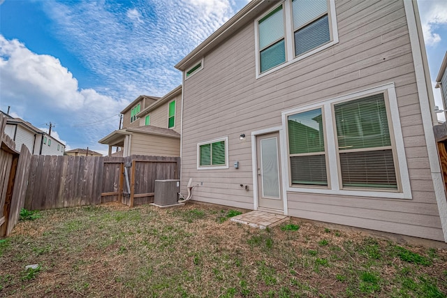 back of property featuring central AC unit