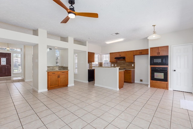 kitchen with ceiling fan, pendant lighting, light tile patterned floors, and black appliances