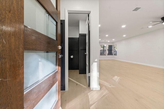 corridor with light parquet flooring