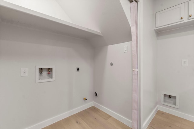 clothes washing area with electric dryer hookup, hookup for a gas dryer, hookup for a washing machine, and light hardwood / wood-style floors