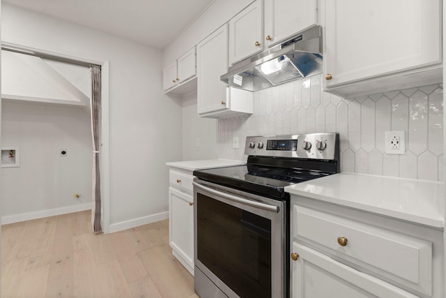 kitchen featuring backsplash, white cabinetry, light hardwood / wood-style flooring, and stainless steel range with electric stovetop