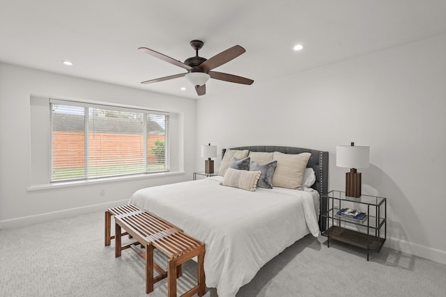 bedroom featuring ceiling fan and light carpet