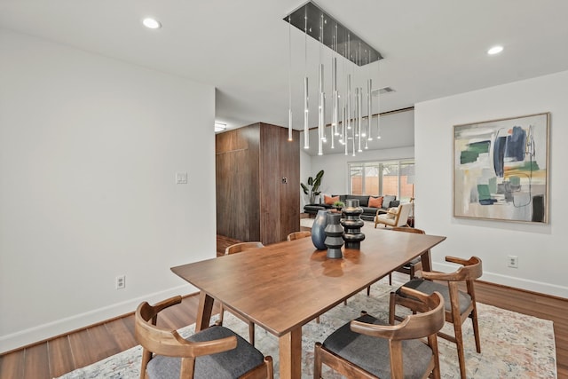 dining area with hardwood / wood-style flooring