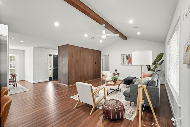 living room featuring hardwood / wood-style flooring, lofted ceiling with beams, and ceiling fan