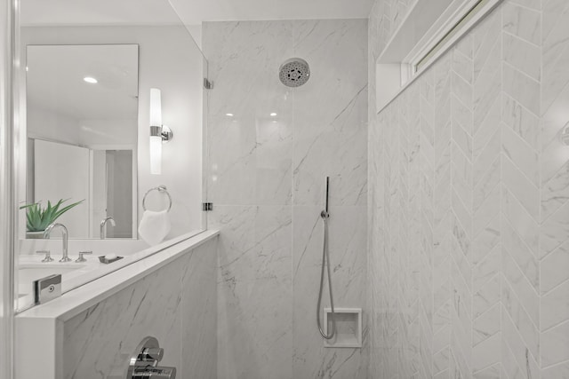 bathroom with tiled shower