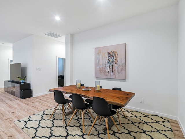 dining space with light wood-type flooring