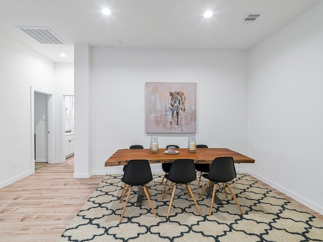 dining space featuring light wood-type flooring