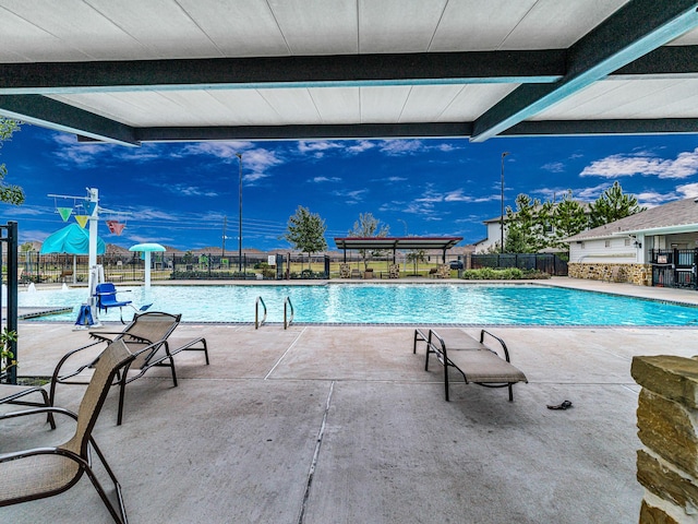 view of swimming pool featuring a patio