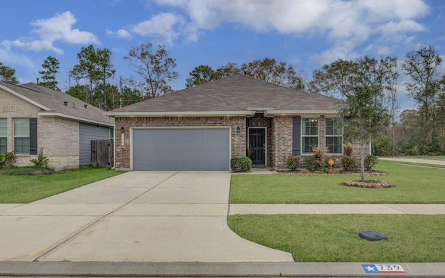 ranch-style house with a garage and a front yard