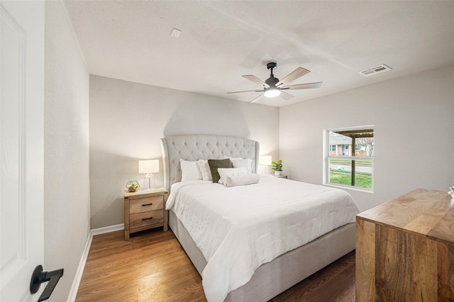 bedroom featuring ceiling fan and hardwood / wood-style floors