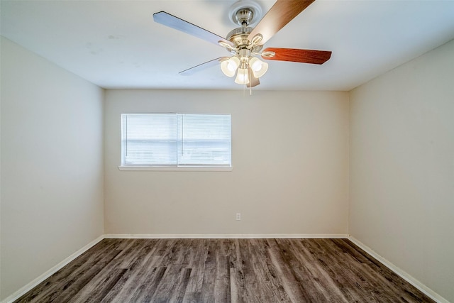 empty room featuring ceiling fan and dark hardwood / wood-style floors