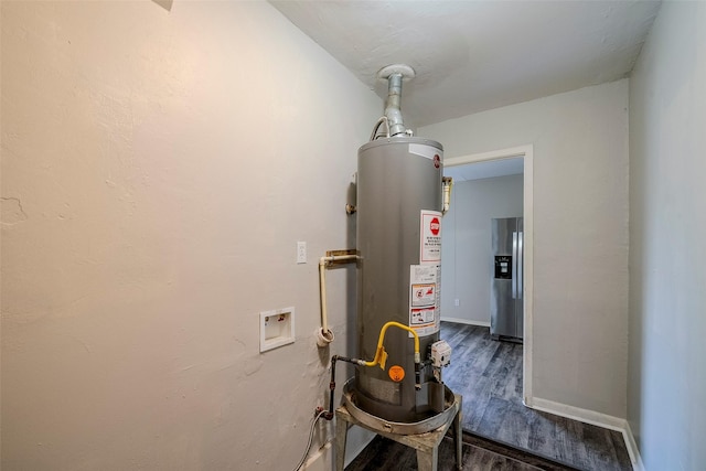 utility room featuring water heater