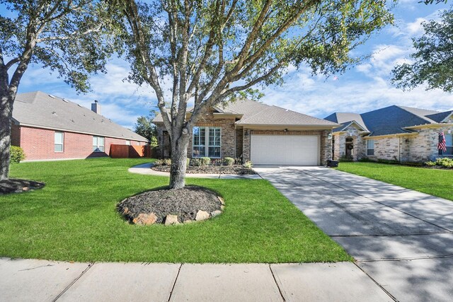 single story home with a garage and a front yard