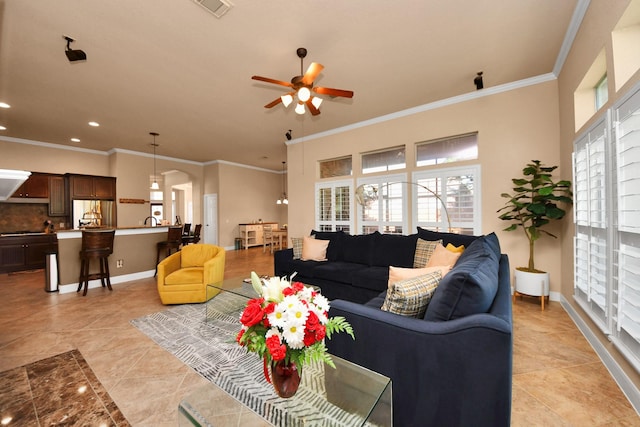 living room featuring ornamental molding, ceiling fan, and light tile patterned flooring