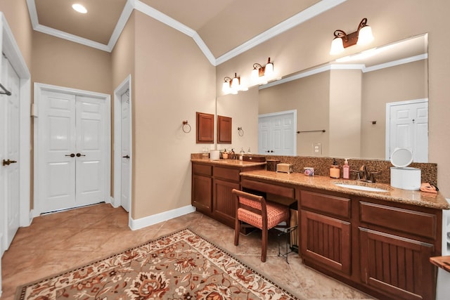 bathroom featuring tile patterned flooring, crown molding, lofted ceiling, and vanity