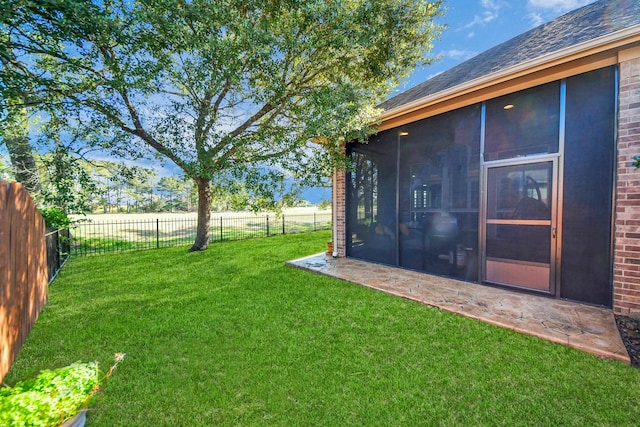 view of yard featuring a sunroom