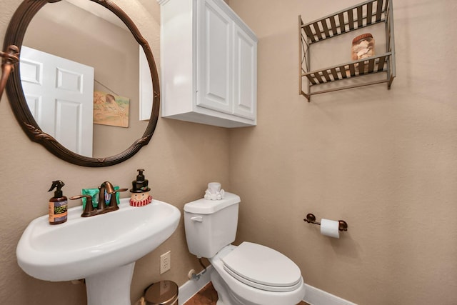 bathroom with sink and toilet