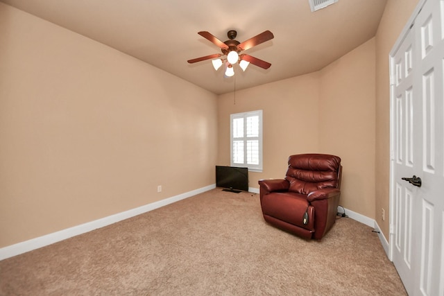 unfurnished room with light colored carpet and ceiling fan