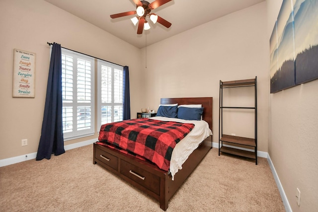 bedroom featuring ceiling fan and light carpet