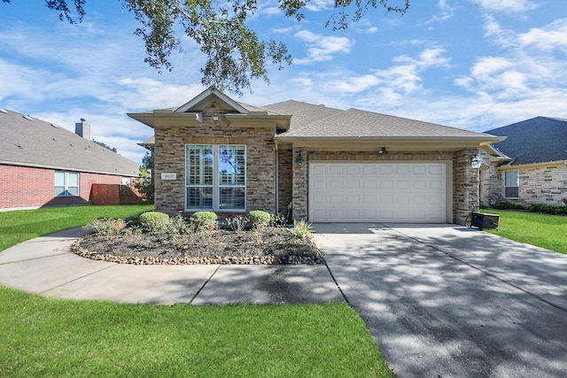 view of front of house with a garage and a front lawn