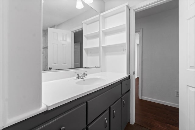 bathroom with hardwood / wood-style floors and vanity