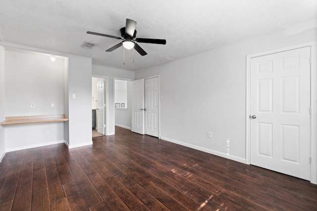 interior space featuring ceiling fan and dark hardwood / wood-style floors