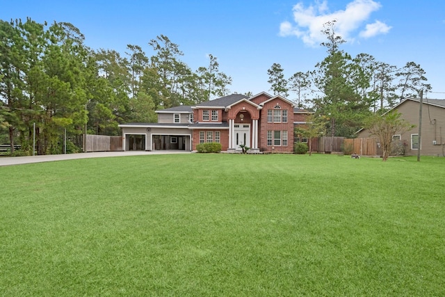 view of front of property with a garage and a front yard