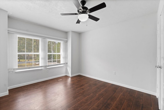 unfurnished room featuring ceiling fan and dark hardwood / wood-style floors