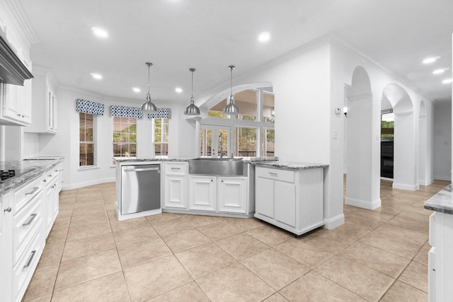 kitchen with dishwasher, pendant lighting, light tile patterned floors, and white cabinetry