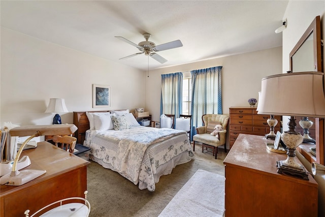 bedroom with ceiling fan and light colored carpet