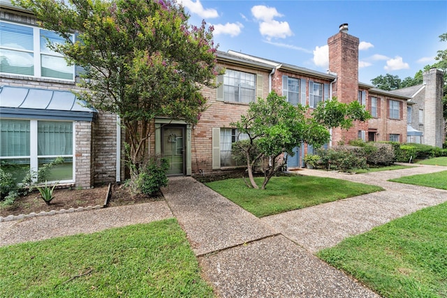 view of property with a front lawn