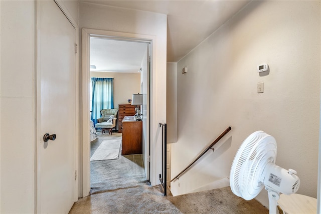 hallway with light colored carpet