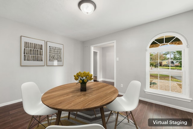 dining space with dark hardwood / wood-style floors