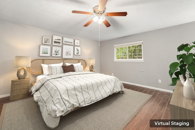 bedroom with dark hardwood / wood-style flooring and ceiling fan