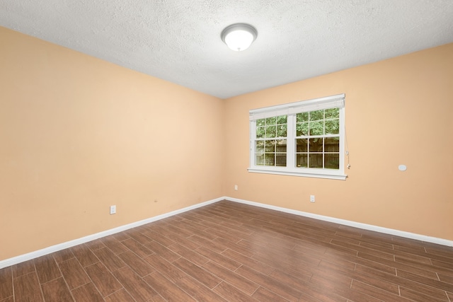 spare room featuring a textured ceiling