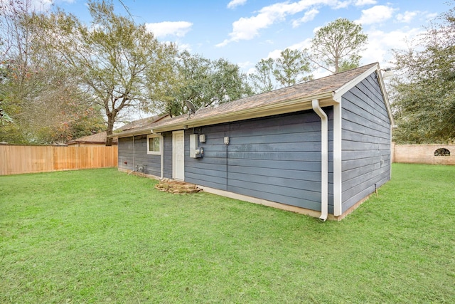 garage featuring a yard