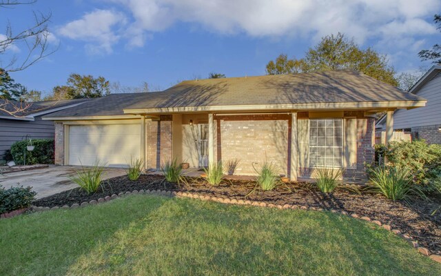 ranch-style house with a front lawn and a garage