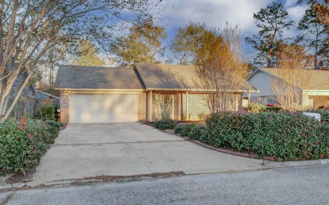 single story home featuring a garage