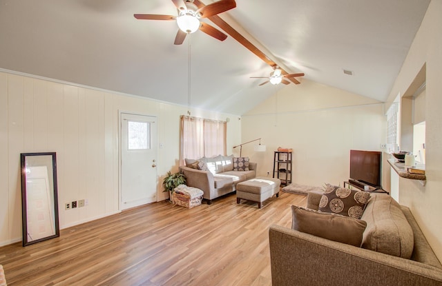 living room featuring lofted ceiling with beams, ceiling fan, and light hardwood / wood-style flooring