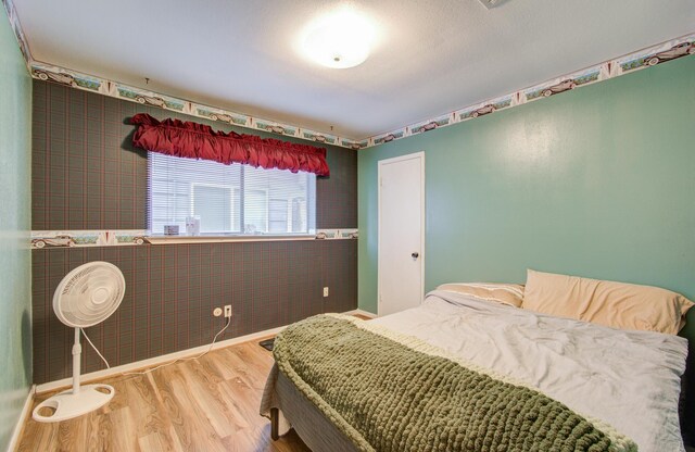 bedroom featuring hardwood / wood-style flooring