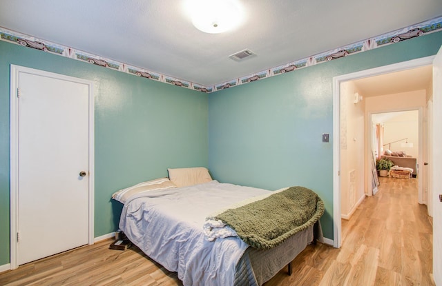 bedroom featuring light wood-type flooring