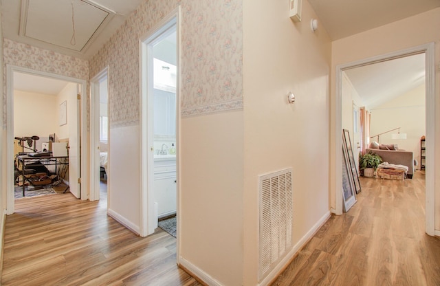 corridor featuring light hardwood / wood-style flooring