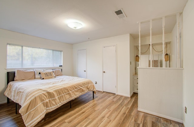 bedroom featuring hardwood / wood-style floors